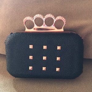 Black and gold snap clutch